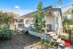  2 Church Street Nana Glen NSW 2450 $539,000 - $569,000 This charming country cottage is the ideal place to start if you want to live off grid & enjoy this most beautiful little paradise of your own. Live like you are a million miles from the rest of the world, yet have the convenience of being a few hundred meters from everything you need. The corner store, bottle shop, cafe, pharmacy, local primary school & pre-school, service station, playing fields & swimming holes are all within a short walk from your home. All this & situated in the end of a quiet country cul-de-sac, just 25 minutes drive to the thriving city of Coffs Harbour & 20 mins to the beach. From the white picket fence at the front, to the beautiful crystal clear stream at the rear, this delightful property has so many quaint aspects you will love. Those wanting to live off grid & eat of the produce from your own land will appreciate all that's been done here to set up a lifestyle you can reap the benefits of for many years to come. With approximately 40 different types of fruit trees & food producing plants in the garden, the foundation has been laid for the keen gardener. From your sunny back verandah deck, there is nothing but the serene green valley & views as far as the eye can see. Looking out on the misty mornings over the paddocks & across the stream is a picture that dreams are made of. A shady, treed covered corner of the garden will be the children's magical wonderland to play in for hours on end - complete with a treehouse overlooking the nearby stream & farmland. Original hardwood floors & fireplace will appeal to those who love character & a relaxed cozy country feel. If you are longing for a simpler life and want to return to the land without having to buy the big acreage to do it, this property will certainly fit your requirements on many levels. 