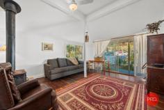  2 Church Street Nana Glen NSW 2450 $539,000 - $569,000 This charming country cottage is the ideal place to start if you want to live off grid & enjoy this most beautiful little paradise of your own. Live like you are a million miles from the rest of the world, yet have the convenience of being a few hundred meters from everything you need. The corner store, bottle shop, cafe, pharmacy, local primary school & pre-school, service station, playing fields & swimming holes are all within a short walk from your home. All this & situated in the end of a quiet country cul-de-sac, just 25 minutes drive to the thriving city of Coffs Harbour & 20 mins to the beach. From the white picket fence at the front, to the beautiful crystal clear stream at the rear, this delightful property has so many quaint aspects you will love. Those wanting to live off grid & eat of the produce from your own land will appreciate all that's been done here to set up a lifestyle you can reap the benefits of for many years to come. With approximately 40 different types of fruit trees & food producing plants in the garden, the foundation has been laid for the keen gardener. From your sunny back verandah deck, there is nothing but the serene green valley & views as far as the eye can see. Looking out on the misty mornings over the paddocks & across the stream is a picture that dreams are made of. A shady, treed covered corner of the garden will be the children's magical wonderland to play in for hours on end - complete with a treehouse overlooking the nearby stream & farmland. Original hardwood floors & fireplace will appeal to those who love character & a relaxed cozy country feel. If you are longing for a simpler life and want to return to the land without having to buy the big acreage to do it, this property will certainly fit your requirements on many levels. 