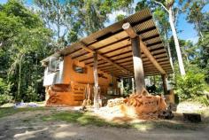  Lot 12 Oak Forest Road, Kuranda , QLD 4881 SUSTAINABLE OFF THE GRID IN STYLE WOW - If you are looking for something that allows your imagination to run wild, offers you a space to call home that is totally off the grid, private, functional & one of a kind - You will be very happy with this unique opportunity. This block is approximately 5.2 acres, totally tucked away and has loads of improvements is an understatement. A solid structure that offers living & sleeping areas 2 Sheds Solar power 2 Rainwater tanks Edible gardens So much more Contact the agent for more information and a private inspection. Land: 	 2.1044 ha / 5.2 acres Bedrooms: 	 3 Bathrooms: 	 1 Learn more.. 