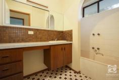  197 North Road Chiltern VIC 3683 $649,000 "Nulgerong" is a rare rural/residential property on 5 Acres, only 1km from centre of Chiltern township. This generous family home would be perfect for those also wanting space for their beloved horses or even to graze a few cattle. This brick veneer residence, built approx. 1972, offers four bedrooms – two with built in robes and the spacious master has a walk-through robe and a private ensuite. The huge central kitchen flows into both a lounge room, with a separate dining area and the family room, which has space for a study nook. The family room leads to three bedrooms and the main bathroom, making it the perfect kids' rumpus room. As well as a double lockup garage with remote control roller doors and a garden shed, this property also has a neat, 5 x 5m, open front storage shed with a concrete floor, ideal for a boat, extra cars, or a workshop. This property is on a bend in the road so it offers many potential uses for the land. It also abuts an unused roadway so there is additional land beside the block that you may be able to utilize (STCA). The grounds around the house boast mature, low maintenance, native trees and shrubs along with some productive fruit trees. A mix of standard and raised garden beds make up the fruitful vegetable garden. With approx. 5acres you can have the kids' horses, a couple of goats and room for a motorbike if that's what you're into. "Nulgerong" is serviced by mains water, a rainwater catchment tank plus two dams! The property fronts a main sealed road and is within walking distance to Chiltern's town centre, primary schools and sporting facilities. 