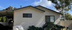  5 Grant St Dalwallinu WA 6609 $399,000 Well appointed 4 bedroom, 2 bathroom home on a 911sqm block.  Large open plan kitchen / dining / living area provides ample space for the family, also featuring slow combustion wood fire, seperate tv area off the living area & all while having access to the outside alfresco area and backyard. Kitchen comprises of double stainless steel sink, dishwasher recess, electric oven & gas cooking with built in rangehood. Central hallway of the home provides access to all the bedrooms & main bathroom. All bedrooms are generously sized with built in robes & ducted evaporative A/C, while the master bedroom includes an ensuite comprising of vanity, W/C & shower recess.  Main bathroom has vanity, seperate shower recess & bath.   Small rear storeroom is accessible from the rear alfresco.   Double carport with concrete driveway & plenty of room for extra cars.   Rear access to the backyard via double colourbond gates at side of home.  