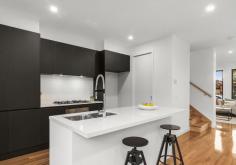  2/72 Nimmo St Essendon VIC 3040 Nestle into this prestigious neighbourhood and enjoy the generous space this architecturally designed town home offers. Finished to the highest of standards and showcasing luxury inclusions, this flawless home is ready for you to enjoy. Lavish Blackbutt solid timber floors seamlessly guide you from the entry, through the large living space and into the open plan kitchen/dining that’s bathed in natural light. Hosting is seamless in the contemporary kitchen that’s wrapped in 2-tone cabinetry, stone benchtops, and an entertainer’s island bench. Amongst substantial storage and extensive prep space, SMEG stainless steel appliances have been fitted. High ceilings are enjoyed throughout the home adding to the already large spaces which flow brilliantly to the outdoor entertaining yard. This luxurious 3-bedroom home continues to provide loads of space on the upper level. The master enjoys its own walk-in robe and luxe ensuite. The 2nd and 3rd bedroom are serviced by a central bathroom that includes a tub. Both bathrooms include porcelain floor to ceiling tiles, stone tops, shaving cabinets and frameless shower screens. A flawless home in a first-class location that surrounds you with convenient public transport options, easy access to Citylink, parks, popular cafes, shops, and restaurants. Conveniently connected to popular private and public schools, it’s the only place to be. Other features include- -Zoned Brivis ducted heating with refrigerated cooling -Guest powder room (3rd toilet) on the living level -2340mm high doors throughout -Stone benchtops to all wet areas -Fridge water point -Square set cornice -NBN ready -Bosch alarm system -Stacker doors -Remote garage -On site guest parking 