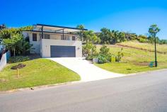  16 Parker Road Cannonvale QLD 4802 - 330m2 of house - awesome entertainment deck with water feature - spectacular relaxing views of the lake, parkland and mountains - close to shopping centre and handy to everything - multi-level modern home - fully air-conditioned - 4 kingsize bedrooms (all with built in robes) - 2 bathrooms (master ensuited and main separate from toilet) - gourmet kitchen with gas cooktop and granite bench tops - living area with access to the entertainment deck - walk through study - terraced yard complete with above-ground garden beds, and fruit trees. - double lock up garage complete with storage areas both sides plus under stairwell storage room - man's cave in undercroft The home was built in 2008 by Canfell Constructions. It is 330m2 in area. 