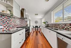  25 Sherwin Place Melba ACT 2615 Perfectly positioned at the end of a quiet cul-de-sac in the highly sought after suburb of Melba is this beautifully presented 3 bedroom home. Just a stone's throw from Scarlett Street Playground, a short walk to local schools, shops and ovals as well as an easy commute into Belconnen and the city, the location is as convenient as they come. Internally, the floorplan flows seamlessly across 109.81m2 of light-filled living. The stylish kitchen is fully equipped with everything you need to prepare a home-cooked meal which can be enjoyed in the separate dining room. The 3 bedrooms, 2 complete with built-in robes, are all spacious and serviced by the well appointed bathroom and separate toilet. Externally, the back yard is beautifully landscaped and complete with lush lawn, raised garden beds and a covered entertaining area. Under the house you will find a large carpeted storage area room which could easily be transformed into a home office, wine cellar or whatever addition you require. Additional creature comforts include ducted gas heating and evaporative cooling, a laundry room with external access and a secure single garage. Features: Light filled living area Separate dining Kitchen with freestanding cooktop and oven, dishwasher and ample bench and storage space 2 bedrooms with built-in robes Spacious 3rd bedroom Well appointed main bathroom Separate toilet Laundry room with external access Ducted gas heating and evaporative cooling Single and retro fit double-glazed windows Fully landscaped backyard Covered entertaining area Under-house storage room/multipurpose area Secure single garage 