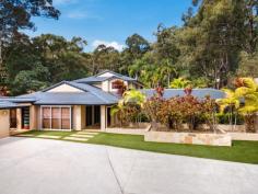  7 Cheshire Grove Elanora QLD 4221 This large resort style home sprawls over 1 and 1/4 acres of land offering the ultimate in space, privacy ,security and seclusion and yet is located only minutes from the beach, major shopping centres and quality schools. The home is uniquely designed with four separate interconnecting pavilions offering multiple living environments for family and guests. The main home offers, five generous bedrooms plus study, 3 bathrooms, separate designated media room and gymnasium and features:- • Gourmet kitchen with quality stainless steel appliances, stone tops and two-pac finish; • Open plan living areas with iron bark flooring throughout; • Master bedroom with ensuite and his and her walk in robes; • Quality bathrooms, ducted air conditioning, plantation shutters. The main house is connected to the separate pool house pavilion by a covered walkway offering the ultimate in indoor/outdoor entertainment featuring:- • Spacious living and dining areas; • Full outdoor kitchen facilities with stone tops, built in BBQ and bar fridges; • Aluminium bi fold doors offering the complete indoor/outdoor experience; • Completely separate shower and toilet facilities; • Built in fireplace and television, timber ceiling feature, sandstone tiles, ceiling fan; • Overlooking the sparkling inground pool with glass pool fencing and sandstone tiles. The guest pavilion on the opposite side of the pool offers a fully self-contained living environment for guests or the extended family. The garage pavilion offers a completely secure environment for multiple cars and essential "toys" and is equipped with, two-pac cabinetry with stone tops and a wash down area for motorbikes or boats serviced by 4 x 3000 litre water tanks that can also be used to irrigate the manicured lawns and gardens throughout the home. The home is fully fenced with electric gates and is further secured by camera and alarm systems offering a very private and secure living environment in an excellent location close to all facilities. 