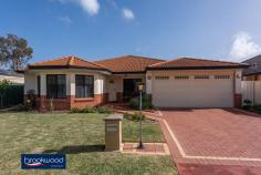  3 Minora Way Jane Brook WA 6056 $515,000 Embrace life in Jane Brook, confident in the knowledge that this home will adapt to the changing needs of a growing family. Multiple living areas, a separate adults’ zone, generous junior bedrooms, and a large media/activity room create a flexible floorplan with a spacious open plan kitchen/meals/family room at its heart. 4 bedrooms 2 bathrooms 2005-built brick and tile Formal & informal living Sep media/activity room Central open plan design Reverse cycle ducted AC Wrap-around alfresco ent 16-panel 3kW solar array Low maint 576 sqm block Parks, lakes, Hills, Valley This spacious family home sits behind the sweep of a green lawn and steps from the open space of Jane Brook Reserve. The front door opens into a tiled entryway with a formal lounge to one side and the spacious main suite to the other. The sunken lounge offers a quiet, east-facing sanctuary away from the activity of the central open plan. In the principal suite, a large bay window delivers ample natural light to a room finished in a calming neutral colour scheme. A walk-in robe and well-appointed ensuite build on the atmosphere of a private retreat. At the heart of the home is an expanse of open plan living with an adjoining activity media room. This flexible design delivers the freedom to adjust to changing priorities as your family grows and needs change. The kitchen is set in one corner of the open plan area and features a 4-burner gas hob, an electric wall oven and a walk-in pantry. A shoppers’ entry, ample under bench storage and an integrated breakfast bar make daily life a little easier. With space for a family-sized sofa and table and access to the wrap-around verandah, this family hub is sure to provide the backdrop to years of memories. Double doors open to reveal a large media/activity room and expand the functional living space. A gas bayonet in this room supplements ducted reverse cycle AC throughout the home. In the separate junior wing, three good-sized bedrooms with carpet and built-in robes are sure to delight children of all ages. A shared family bathroom with tub, shower and vanity, a separate WC and a walk-through laundry complete the layout of the junior wing. A sliding glass door connects the central living zone to a paved wrap around verandah with the 2-car garage at one end, and a Colorbond garden shed at the other. This expansive area, edged with raised garden beds, offers year-round outdoor living with both northerly and westerly aspects. Steps from the front door of this home is a reserve and walking path leading to the lakes and parks of Jane Brook. The shops and services of Midland are a short drive away, and primary and secondary schools are within easy reach. A Foothills setting delivers the outdoor adventure of the Perth Hills and the gourmet delights of the Swan Valley in equal measure. 