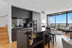  2605/421 King William Street Adelaide SA 5000 $899,000-$949,000 This luxurious two-storey penthouse apartment will make you feel like you're on top of the world! Prestigious executive living is yours to enjoy, with stunning views and a state-of-the-art quality interior. A spacious open plan living and dining area has parquetry oak flooring, modern fireplace, and an up-to-the-minute Samsung TV, theatre system with multi-room audio and RTi iPad/RX7 touchscreen system. Floor to ceiling windows showcase the staggering views across to the coast. Step out onto a private balcony and share a bottle of wine while the sun sets. The gourmet kitchen is a chef's dream. Miele appliances, induction cooktop, built-in fridge, dishwasher and even a coffee machine are included alongside quality granite bench tops and sleek cabinet storage. There are incredible views from both bedrooms, with the main bedroom in a coveted corner position. Both the en suite and main bathroom are gorgeous, with marble floor-to-ceiling tile and a dual vanity to the main. Entertaining? Step up to your own private rooftop entertaining balcony, complete with full outdoor kitchen. Fully fitted with a barbecue and bar fridge, you can kick back and let the good times roll! An additional store room is a huge bonus. Vue on King William is an award-winning building designed for upscale living. A full sized pool and sun deck, plus quality recreational gym, are available for use on level 7. An intercom system offers peace of mind, and there are two secure car parks assigned to you. Live in the centre of Adelaide and explore everything this exciting city has to offer. Exciting gourmet eateries along Gouger St, the fresh produce in the famous Central Markets and some of the best coffee shops in the world are all within a short walking distance. The free Adelaide tram stops just outside the door, making it easy to get around the CBD. Or take a ride to Glenelg! Adelaide is host to a swathe of prestigious schools and every amenity you could want. This is a true lifestyle opportunity for the discerning buyer who only wants the best. A must to inspect! What we love: . Amazing central location close to cafes, markets, entertainment and public transport . Gorgeous two-storey penthouse finished to perfection . Exclusive rooftop entertaining balcony with outdoor kitchen . Panoramic views from almost every room across to the coastline and hills . Gourmet kitchen with Miele appliances . Stunning upscale en suite and main bathroom . Samsung TV, theatre system, multi-room audio, RTi iPad/RX7 touchscreen system . Ducted reverse cycle air conditioning . Floor to ceiling windows . Superbly finished to the very highest quality throughout . In award-winning Vue on King William, with pool and gym . Two secure car parks 