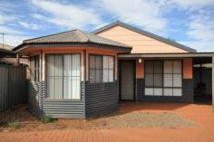 5/23 McLennan Drive Newman WA 6753 $249,000 Welcome to your new home... Why pay you Landlord's mortgage, when you can pay off your own! This villa is as spacious as many standard 3 bedroom homes in Newman. Located at the rear of a common drive way, it is one of only 10 units in the entire complex. Designed with unique bay windows, unit 5 offers a very light and bright combined kitchen/dining room, a separate lounge room and three good sized bedrooms. The master bedroom has an impressive walk-in robe and direct access to the bathroom, providing an ensuite type of effect. All rooms are serviced by good quality split air conditioning and new wood look vinyl plank flooring has recently been laid in high traffic areas. This three bedroom villa offers all the modern conveniences you'll ever need and want: • Three bedrooms with a centrally located bathroom • Spacious living areas • Split system air conditioning in all rooms • Rear under cover patio area and back yard • Separate lounge room • Light and bright full kitchen with adjoining dining room • Vertical blinds throughout the property • Nautical coloured bathroom which offers a full sized bath tub and separate shower • Paved drive way with an under cover parking space for one vehicle • Safe and secure strata complex 