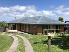  54 Welshpool Rd Toora VIC 3962 $499,000 Set on approx. 970m2 of land with views out over rear farmland to the waters of Corner Inlet and the mountains of Wilsons Prom, this brick residence has been updated to cater for a modern lifestyle. Spacious living area with polished timber flooring and sunken lounge centered around a wood heater. Separate dining room with RC/AC opens out to a terrace and adjoins the modern kitchen - brilliantly appointed with stylish timber bench tops, stainless appliances, excellent storage and a breathtaking view, imagine cooking dinner watching the sun set over the water. Three fitted bedrooms with polished floors and overhead fans for year - round comfort. Stunning central bathroom with double frameless shower, freestanding bathtub, feature vanity & wc. Separate laundry / utility room with built in storage,external access and separate w.c. Outside is easy care, the rear garden is fully fenced and secure for pets and littles, with a LU storage shed and chook pen. Low running costs with solar and mains power and instant gas hot water. Fast speed NBN offers the ability to work from home. Part time, full time, first home, last home - this one will tick all the boxes for so many buyers, just a short stroll to the centre of town, the heated public pool, medical centre, parkland, Rail Trail - and 2km from boat launching. 