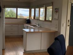  54 Welshpool Rd Toora VIC 3962 $499,000 Set on approx. 970m2 of land with views out over rear farmland to the waters of Corner Inlet and the mountains of Wilsons Prom, this brick residence has been updated to cater for a modern lifestyle. Spacious living area with polished timber flooring and sunken lounge centered around a wood heater. Separate dining room with RC/AC opens out to a terrace and adjoins the modern kitchen - brilliantly appointed with stylish timber bench tops, stainless appliances, excellent storage and a breathtaking view, imagine cooking dinner watching the sun set over the water. Three fitted bedrooms with polished floors and overhead fans for year - round comfort. Stunning central bathroom with double frameless shower, freestanding bathtub, feature vanity & wc. Separate laundry / utility room with built in storage,external access and separate w.c. Outside is easy care, the rear garden is fully fenced and secure for pets and littles, with a LU storage shed and chook pen. Low running costs with solar and mains power and instant gas hot water. Fast speed NBN offers the ability to work from home. Part time, full time, first home, last home - this one will tick all the boxes for so many buyers, just a short stroll to the centre of town, the heated public pool, medical centre, parkland, Rail Trail - and 2km from boat launching. 