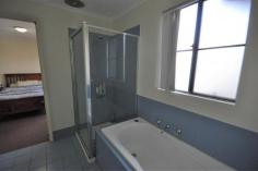  5/23 McLennan Drive Newman WA 6753 $249,000 Welcome to your new home... Why pay you Landlord's mortgage, when you can pay off your own! This villa is as spacious as many standard 3 bedroom homes in Newman. Located at the rear of a common drive way, it is one of only 10 units in the entire complex. Designed with unique bay windows, unit 5 offers a very light and bright combined kitchen/dining room, a separate lounge room and three good sized bedrooms. The master bedroom has an impressive walk-in robe and direct access to the bathroom, providing an ensuite type of effect. All rooms are serviced by good quality split air conditioning and new wood look vinyl plank flooring has recently been laid in high traffic areas. This three bedroom villa offers all the modern conveniences you'll ever need and want: • Three bedrooms with a centrally located bathroom • Spacious living areas • Split system air conditioning in all rooms • Rear under cover patio area and back yard • Separate lounge room • Light and bright full kitchen with adjoining dining room • Vertical blinds throughout the property • Nautical coloured bathroom which offers a full sized bath tub and separate shower • Paved drive way with an under cover parking space for one vehicle • Safe and secure strata complex 