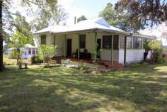  2752 Batlow Road Kunama NSW 2730 Set well back from the road in a well established garden, this amazing lifestyle property offers lots of options for your new life in the country. Formerly the Kunama School (1921) and headmaster's residence, this property is spread over 2 titles, and is fully fenced, with a fabulous sunny aspect. It comprises both the house AND the schoolhouse, which is currently used as an artists studio, plus a newly constructed two bay shed / garage. The old schoolhouse would make the perfect Airbnb or farm stay. The cleared paddock beyond the house garden lends itself to a variety of uses. Plant it out to a fruit and nut orchard, grow cider apples for the commercial cidery just down the road, establish your own oak forest to produce truffles, or just run a few cattle or some horses for the kids. The cosy cottage is surrounded by established gardens full of mature trees, flowering shrubs and bulbs. Magnolias, Japanese maples, rhodendrons, azaleas, daffodils and tulips, boronia and Dutch iris create a colourful and peaceful place to relax. Inside, the cottage currently offers 2 bedrooms and a sunroom, however this could be reconfigured to 3 or 4 bedrooms without increasing the current footprint, or extend it even further to include a north eastern deck to take in the magnificent views across the valley, all the way to the Blowering escarpment. The home itself has a nice homely family feel. Features of the house include: New roof and insulation New exterior painting High ceilings Slow combustion fire in lounge / dining area Ducted central heating throughout North facing eat-in kitchen with a fabulous Nectre Bakers Oven / slow combustion stove, plus electric oven, gas cooktop and new cabinetry - all renovated in 2019 All underhouse plumbing and stormwater management recently renewed A spacious front verandah, shaded by magnificent Californian Redwoods The picturesque Old School House also has a new roof, flued gas heating, and has been recently painted. It has soaring ceilings with full length windows down either side, making it a light and bright open space. Currently used as an artist's studio, it could offer a great space to establish a new work from home business, a yoga or therapy space, or perhaps renovate to create a separate holiday letting (STCA). The possibilities of this property are endless! And with the choice of Batlow (3kms), Tumbarumba (30kms) and Tumut (30 kms ) all within easy reach, you will have all the conveniences and essential services of town close by. 