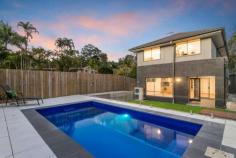  54 Carinya Street Indooroopilly QLD 4068 Offering convenience, luxury and a family friendly floorplan, this as-new home of outstanding quality is designed to provide a beautiful lifestyle. Positioned on a low maintenance block with idealised north-east aspect, opposite Carinya Street Park. Expansive master suite with spacious walk in wardrobe Separate study overlooks Carinya Street Park Indooroopilly State School & State High School Catchment Sprawling open plan living & dining Ducted air conditioning with sophisticated smart control touch panel Equipped with Smeg & Barazza kitchen appliances Metricon designed & built Four minute drive to Indooroopilly Shopping Centre Multiple living spaces to accompany five large bedrooms Victorian ash hard timber staircase with toughened glass balustrade. 