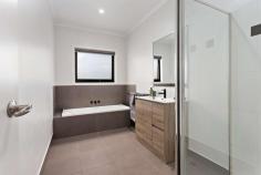  2/36 Genista Street Frankston South VIC 3199 $760,000 - $836,000 Offering a supreme example of an effortless lifestyle combined with ample light-filled spaces, this immaculate three-bedroom villa is the ultimate expression of sleek, low-maintenance living. Ideally located amidst the leafy streets Frankston South is so well known for, close to tranquil Sweetwater Creek Nature Reserve, Towerhill Road Shops, and set in the highly sought after FHSZ. Showcasing a stunning monochromatic colour palette off-set by minimalistic gardens, this striking abode offers peaceful permanent living, cleverly using every corner of the 224sqm (approx.) allotment to deliver stunning spaces for breezy entertaining and the quintessential peninsula lifestyle. Encourage intimate family time in a cozy and sun-drenched open plan domain, where gleaming timber floorboards connect a bright entrance with a generously sized lounge, dining and kitchen area, complete with laundry access, breakfast bar and courtyard views; making this the perfect place to host guests, whilst remaining part of the festivities. Warmer months invite free-flowing entertaining through glass sliders, extending the internal lounge with a surprisingly spacious alfresco area, inclusive of vaulted ceiling and cafe blinds. Seamless connection to a tranquil courtyard completes this entertainer's haven with a designated fire pit. An adjoining accommodation domain reveals three bedrooms (BIRs), inclusive of master with ensuite, and all with views to the immediate gardens and stylish main bathroom and a private WC. Additional features include; Split system in master bedroom and living, garden shed and SLUG with alfresco access. Meticulous in presentation and the epitome of easy and convenient living, this gorgeous home will undoubtedly attract the interest of many. Central to all the spoils of the Mornington Peninsula and only moments to public transport options, enviable coastlines and easy freeway access. 