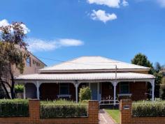  120 Arthur Street Wellington NSW 2820 $495,000 This may look like an unassuming cottage from the outside but this Vamp will use her charm or wiles to seduce you when you least expect it. Open the door to experience her endless talents! She has just retired from working as a B&B and that brings with it many advantages including the 3 bathrooms that are fit for the family or maybe your many guests who will thrill at your new home. The beauty of this Home is that she has the class and style befitting her era and yet she has discovered the benefits of modernity and has taken the time to revamp certain parts of her to today’s standards without losing her charm. The kitchen, for instance, is as youthful as you can get with all the conveniences of today's era, opening into a very large L-shaped living area that just keeps going. The living area is light and airy with picture windows that welcome the outside and give you a feeling of freedom. The main bedrooms are large, especially the master which boasts the ability to accommodate a king-sized bed in its stride. There is also a study or 5th bedroom which is also a decent size. Outside there is a large garage and established gardens to delight and plenty of room to place your mark on the landscape. o 4 King sized bedrooms o Study o 3 bathrooms o Modern kitchen o Large garage o Car Port o Automatic security gate. 