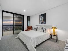  4704/71 Eagle Street Brisbane City QLD 4000 Towering above the water and city skyline along a prestigious stretch of the Brisbane River, this executive apartment unveils refined luxury and absolute riverfront living within the renowned Riparian Plaza. Elevated high atop the 47th floor and harnessing awe-inspiring views, this esteemed address presents an unrivalled lifestyle reserved for discerning professionals. Spanning 212sqm adorned with bespoke fittings, luxury appointments and architectural style, the apartment opens to an enviable living and dining area adorned with floor-to-ceiling glass framing your iconic outlooks across the sweeping suburbs, mountains and river. Opening to a full-length balcony taking in the enchanting Brisbane sights, residents are presented with a flowing layout and custom kitchen showcasing sleek cabinetry, stone benchtops and premium appliances. The pinnacle in waterfront living, the apartment hosts two bedrooms, each opening to the sprawling balcony. The master reveals a walk-in robe and ensuite, while the second bedroom is serviced by a lavish bathroom with a freestanding bath. Additional luxury features include: Electric blinds; zoned ducted air-conditioning; internal laundry Private river-facing foyer with 10m high ceilings 24/7 security and concierge; two secure car spaces 5-star amenities, including a lap pool, gym, steam room, sauna and spa Functional meeting spaces and BBQ facilities Prestigiously positioned on the river's edge by Brisbane's famous boardwalk; residents will enjoy an exclusive lifestyle surrounded by the city's premier restaurants, cafes and bars. A short stroll to Eagle Street Pier, Howard Smith Wharves, ferry, and moments to the Botanic Gardens and city centre - this esteemed lifestyle is truly unique. 