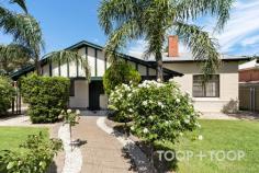  14 Shearer Street Kilkenny SA 5009 Surrounded by lush, manicured gardens, this classic character bungalow offers the dream lifestyle in one of Adelaide’s fast-growing suburbs. Just one street from West Croydon, this property offers exceptional value whilst still being moments from Queen Street Café, a short drive to North Adelaide and merely 4 train stops from the CBD. An impressive entrance exudes grandeur and leads though to the large open plan kitchen, dining and living, the ultimate hub of the home. A quality timber kitchen makes cooking a breeze, whether for one or an army. Packed full of features including gas cooking, wall oven, ample storage, and bench space plus breakfast bar. Outside, a massive gabled pergola is the perfect setting for entertaining an endless amount of friends and family in year round comfort. Side access from Downer Street allows for this space to double as vehicle parking. Accommodation is comprised of three huge bedrooms, all with original fireplaces and built-in-robes. The main bathroom has been stylishly renovated with large vanity, glass shower screen, bathtub and dual shower heads. Possessing heart-throb period charms such as polished floorboards, picture rails, lofty ceilings and original fireplaces, this home is true to origins. A property that has been loved unconditionally by the current owners and is now ready for its next custodians. A rare chance not to be missed! 