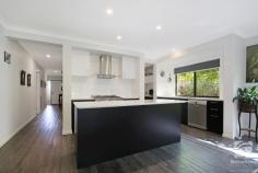 28 Clarendon Avenue Wodonga VIC 3690 $659,000 Thoughtfully designed, this prestigious home is modern yet practical and offers luxuries seldom found in suburban living. Comprising of four spacious bedrooms, all with built-in wardrobes. The master features a walk-in robe, along with additional storage at the opposite end of the room, through the walk-in robe is access to the ensuite with a shower and single vanity. Perfectly positioned central to the bedrooms and living space, the family bathroom offers a separate shower and oversize bath. The free-flowing floorplan allows seamless movement from the kitchen, dining, and living areas. A large island stone bench, 900mm cooktop and massive L shaped butlers pantry, make this kitchen perfect for entertaining. Bifold doors in the family room bring the outside in, while the covered alfresco extends the living space. Oversized established garden beds and lush green lawns are sure to keep the green thumb in the family happy. Past your back fence is a nature reserve and walking tracks, giving you the feeling of added space and tranquillity. Other notable features include split systems in every room, ducted heating, and a double lock-up garage. In a tightly held location of Wodonga, homes like these rarely come available. Don't miss this opportunity to enquire today! 