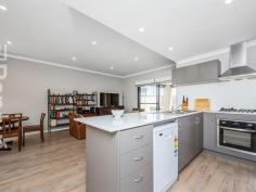  2A Robertsbridge Road  Nollamara WA 6061 Unlike most properties in this price range, this freestanding, street front house, has NO shared driveway, NO common property, NO strata fees, and NO meetings. If you’ve owned strata titled property before, I’m sure you will agree that this is a much better option! This 6 years young house has a cleverly designed floor plan, featuring open plan living areas that enjoy an outlook into the north-facing front courtyard and alfresco, and good separation between parent’s and children’s bedrooms. The inviting and spacious courtyard is light and private, and not at all hemmed-in, as the courtyards of most villas, stacked one behind the other are. The master bedroom, located at the front of the house, has an ensuite bathroom and walk-in robe. The other 2 bedrooms, each with built-in robes, are located at the back of the home, where they share a bathroom. There is direct entry into the home from the generous garage, with automatic sectional door, so there is no need to worry about safety when coming home late at night, or getting wet if it happens to be raining. A second car can be parked on the property forward of the garage. The home has high ceilings, attractive and durable vinyl timber flooring and air-conditioning in the living areas, carpet in the bedrooms, and a security alarm. 