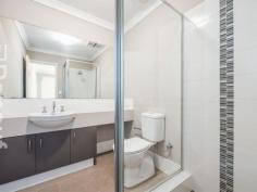  2A Robertsbridge Road  Nollamara WA 6061 Unlike most properties in this price range, this freestanding, street front house, has NO shared driveway, NO common property, NO strata fees, and NO meetings. If you’ve owned strata titled property before, I’m sure you will agree that this is a much better option! This 6 years young house has a cleverly designed floor plan, featuring open plan living areas that enjoy an outlook into the north-facing front courtyard and alfresco, and good separation between parent’s and children’s bedrooms. The inviting and spacious courtyard is light and private, and not at all hemmed-in, as the courtyards of most villas, stacked one behind the other are. The master bedroom, located at the front of the house, has an ensuite bathroom and walk-in robe. The other 2 bedrooms, each with built-in robes, are located at the back of the home, where they share a bathroom. There is direct entry into the home from the generous garage, with automatic sectional door, so there is no need to worry about safety when coming home late at night, or getting wet if it happens to be raining. A second car can be parked on the property forward of the garage. The home has high ceilings, attractive and durable vinyl timber flooring and air-conditioning in the living areas, carpet in the bedrooms, and a security alarm. 