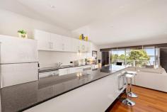  1/3 Beryl Street Warners Bay NSW 2282 Have you been searching for the perfect place to enjoy lakefront living? Here is your chance in a million to secure your own waterfront town home, one of only two, designed with the entertainer in mind. Set on three levels with phenomenal lake views on every one, this inviting home, awash with natural light, is artfully designed for family members and guests alike with masses of entertaining space on the entry level and privately located bedrooms on upper and lower floors. On entry you'll discover rich timber floors and a neutral colour palette in the ideal living/entertaining zone, the heart of which is the gleaming well-appointed kitchen with a massive 3m island bench, Blanco oven and stainless-steel appliances. Adjoining this chef's dream is the luxurious living room with double-glazed windows and sliders to a louvre-roofed waterfront balcony, a simply perfect place to unwind at the end of the day and admire the sunset over the lake. On the other side of the kitchen is a dining space with ample room for an 8-seater dining table, next to a hideaway laundry and powder room. The dining room opens to a large, enclosed tiled courtyard. You could host an alfresco party here, with guests enjoying a drink on the balcony overlooking the lake while you cook up a feast, and then moving to eat dinner in the secluded courtyard when the sun goes down. When the party's over, you can retreat upstairs to the well-proportioned, air-conditioned master bedroom that boasts stunning lake views, double length built-in robes and ensuite with shower. On the lower level, you will find two additional bedrooms, each with built-in robes, lake views and doors to a covered patio from which you can enter the front garden access the Esplanade for a brisk walk to the lake or Warners Bay Village. A study nook and family bathroom with bath and shower can also be found on this level. The two-car garage is accessed via Beryl Street, with secure entry and steps leading down to the courtyard, or alternatively you can access the home via the Esplanade. Directly opposite the alfresco courtyard is a bonus large studio/home office. This modern residence is an ideal location just a few minutes' walk to the lake, shops, supermarkets, and specialty stores as well as a great choice of cafes, restaurants and bars. During the day, take your paddle board out on the lake, or go for a bike ride to explore the waterfront cycleways, and at night head up to Brown Sugar or Canon for a few drinks to end a perfect day. All the conveniences you could possibly need are just a short stroll away. Features include: - Tri-level living, with a sophisticated design that maximises views and space - Exceptional lakefront views from living room and bedrooms that cannot be built out - Three privately located double bedrooms with views, master on upper level with ensuite and split system air-conditioning - Two bathrooms, family bathroom with bath and shower and ensuite to main, separate laundry and powder room - A choice of alfresco dining spaces - on front balcony with louvered roof and stunning views of the lake or in secluded private courtyard - Gleaming white kitchen with stainless steel appliances and 3m island bench - Bonus studio/home office space - Double garage and secure entry accessed via Beryl Street - Pedestrian access to the Esplanade for your daily walk or to browse the shops - Just a short drive up Bayview Street and you're onto the Inner City Bypass to major arterial routes. 