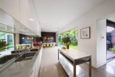  108 Eskdale Rd Caulfield North VIC 3161 $1,550,000 - $1,650,000 Superbly renovated, spacious open plan living with impressive indoor/outdoor connection and surprising tranquillity. This brilliant property contains 3 generous double bedrooms, all with impressive integrated storage, 2 newly updated bathrooms, and an excitingly large open plan kitchen/living/dining space surrounded by lush gardens. This Art Deco classic with a modern extension will impress with its space and privacy. No detail has been overlooked, from the lovingly restored original ornate ceilings, gorgeous hallway with custom bookcase and the marble mantle open fireplace, through to the full height picture window that impresses guests on arrival. In the modern, light filled and expansive family bathroom you'll find a gorgeous freestanding bath, marble vanity, substantial storage, and European laundry. The amazing chef's kitchen with stainless steel bench-top, extensive storage, concealed fridge/freezer and pantry spaces, Ilve 900mm stove, Qasair extractor range, integrated Miele dishwasher, a Carrara marble topped movable island bench will excite the senses, and the chef in the family. Double glazed doors open into the north facing outdoor oasis that includes a readily accessible and plentiful kitchen garden, while the light filled living space adjoining is also easily openable to the lush surrounding gardens and wrap around deck. The highest quality finishes have been used throughout, Carrara marble, designer lighting and double-glazed commercial grade glass, and a year-round climate control via zoned, refrigerated, ducted cooling and heating give this exceptional home an unmistakable edge. Outside garden lighting, extensive sprinkler system, dual water tanks and an automatic gate leading to secure parking for two cars including an open garage with concealed shed and workshop spaces ensure a complete hassle-free and hands off lifestyle. This highly convenient locale gives quick access to Caulfield station, tram, and bus services, is a short walk to Caulfield Park, and within an easy distance of the various private schools in Caulfield and surrounding suburbs. 