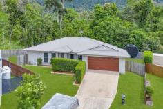  26 Butterfly Court Jubilee Pocket QLD 4802 From relaxing on the patio listening to the birds in the neighbouring rainforest, cooling off in the sparkling in-ground pool or taking your boat out in the bay to enjoy all that this picturesque region has to offer, there is so much to love about 26 Butterfly Court. This air-conditioned four-bedroom, two-bathroom home is set on a 704spm block at the end of a quiet cul-de-sac and is just minutes to Airlie Beach. With multiple living spaces as well as an extended patio with a fire pit and a large grassy backyard, this is an incredible lifestyle opportunity. The kitchen boasts an ASKO dishwasher, sweeping benches, a double fridge cavity and bench seating, making preparing meals a pleasure. When it comes to downtime, you can take your pick from the open-plan dining and family room overlooking the pool or move into the separate lounge overlooking the rainforest. The spacious master bedroom features a walk-in robe and ensuite, while the guest bedrooms have built-in robes. With a double garage as well as side gates for your boat or caravan, this home is bursting with style and appeal. FEATURES: Media Room. 
