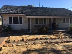  15 Scott St Wyalkatchem WA 6485 $95,000 Situated on the corner of Scott and Swan St. The land is a generous 992m2, the home is jarrah framed fibro clad with a tile roof, 3 generous size bedrooms, lounge with French doors that opens out to the front veranda,  a good sized kitchen – dining with electric stove, neat bathroom, laundry, with electric HWS and WC under main roof, ducted evaporative air conditioning throughout, a gas bayonet is used for winter heating.   The property has a large patio to the rear of the house, a single car garage, the property is well fenced with super six and Colourbond Neeta screen, rear access is available. The property is currently tenanted.   Wyalkatchem is a safe community with a Hospital, Dr, Chemist, School to year 10 and most other services are available. For an inspection please call Eric on 0429886107 to make an appointment to view this property. 