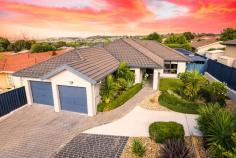  32 Warrumbul Street Ngunnawal ACT 2913 $1,399,000+ Every square inch of this stunning home has been meticulously painstakingly (no cost spared) re-furbished somehow! You’ll be impressed by the presentation of the front garden, its setback & privacy from the road & the ample car parking space available. Next, you’ll be greeted with an extra-wide entry with a blend of oversized porcelain tiles & real hardwood floor creating the homely feel in the formal lounge & dining. French & glass doors are found throughout the living spaces & corridors maintaining the natural light throughout this gorgeous home. A totally renovated & extended kitchen, the home’s heart will impress even the biggest of home dining entertainers with the latest modern up to date finishes & fixtures boasting ample bench space preparation areas, quality cooking appliances & customised fitted out walk-in pantry. Space is certainly not lacking in the open family room, which looks over the rear yard & yields access to an entertainer’s absolute dream! Recently refurbished deck flooring, quality pitched roof with new sun tuff UV roofing including fans overhead and you have an outdoor entertaining oasis with kitchen & spa. You’ll the envy of all your family & friends all year round. Segregated down the “hallway that runs forever” are both bathrooms, separate toilet & laundry, all extensively refitted with modern creature comforts. Bed 4 has been converted into an office with built-in cabinetry comfortable for two people to work from home or a great space for children to study. Built-in robes in bedrooms 2,3 & 4 have been converted to sliding door systems & the internals with all new custom cabinetry. The sizable master has a transformed ensuite & custom fitted cabinetry in the walk-in robe. You’ll also find internal access to the oversized double garage with a mancave workbench space with overhead cupboards & a 5th room storage. The Owners’ Favourite Part: Being able to sit out on the back lawn & watch the view of sky fire across the black mountain tower. We wish we could take this home with us. Features: – Evaporative Cooling – Ducted Gas Heating – In slab underfloor heating – Security system – 8 X external security cameras (recorded) – Underground storeroom – Side 5m X 3m carport – Outdoor Kitchen. 