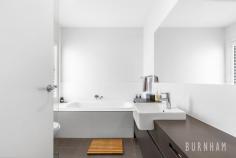  485 Barkly Street Footscray VIC 3011 $730,000 - $800,000 A residence offering mixed-use flexibility captures exactly the appeal of today’s Footscray – a city edge context where living, working, and enjoying are all simultaneously achievable in a single address. This two-bedroom townhouse fuses space, functionality and contemporary living, posing as the perfect opportunity for homebuyers, service providers, entrepreneurs or investors. Spanning over three levels, any entertainer would revel in the chance to occupy this home. The open plan lounge and dining area is enveloped in light and opens to the grand balcony, making indoor/outdoor living effortless. The kitchen features a stone, island bench with breakfast bar, double sink, substantial storage, 900 gas cooktop and plantation shutters. A large powder room with extended bench space, wall to wall mirror, and ample storage completes this level. Unwind in the master suite on the upper level of the home. This space is extremely generous and features, lots of light, plantation shutters, luxe carpet and a walk-in robe with ample storage. The second bedroom follows similar trends. The bedrooms are serviced by a large central bathroom with tub, shower with rainfall shower head, ample storage, lots of light and calming neutral tones. The opportunities are boundless on the lower level of the home, featuring a second living space, that could easily transform into a studio, salon or large office. Located less than 10kms from the city, enjoy easy access to an abundance of amenities. IGA and a variety of Barkly Street shops, cafes and restaurants, EJ Whitten Oval, West Footscray train station, parklands and bus stops are just around the corner. Footscray’s city centre, highway access, Victoria University, multiple schools, the Western Hospital and Highpoint Shopping Centre are only a short commute away. Additional features: – Split system air conditioning and heating in the dining, living and master bedroom – Skylight above the stairs – Two linen cupboards on the upper level, one on the second level – Rear access – Secure, remote-controlled single garage – European laundry – Plantation shutters throughout – Wall panel heater in the second bedroom. 