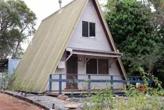 4 Thorne Road Denmark WA 6333 $420,000 This delightful 2 bedroom, 1 bathroom A-frame home is located on a large 1012 sqm block midway between Denmark and Ocean Beach. Well equipped kitchen, extra living area at rear of home, 2 bedrooms upstairs, wood fire heating, 8m x 7m powered garage/workshop and easy care established gardens. The home is shire approved for holiday accommodation, and for your private inspection please contact Kim Barrow at Ray White Denmark on 0427 481 498. 