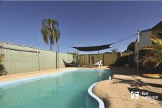  115 Rainbow Street Biloela QLD 4715 $299,000 Sheltered by the private developed gardens you will find this 4-bedroom, 2-bathroom brick home, it is well equipped with all the features for someone who loves to entertain or a growing family, from the large kitchen and outdoor bar to the fantastic pool area this home will support all your needs. The layout is ideal with the kitchen, dining and lounge set at one end and the bedrooms, bathrooms, and laundry down the hall to the other end of the home. There are split-system air-conditioners in 3 of the bedrooms and the lounge along with evaporative cooling throughout and some celling fans. Outside features 2 large, powered sheds + a skillion and a double carport, entertainment area all on a fully fenced 1012m2 allotment. A benefit of purchasing this property is the zero neighbours across the street, located adjacent to the Biloela football fields and within walking distance to all schools. We highly recommend an inspection for those who are chasing a home providing that little bit extra lifestyle, space and storage! Contact Amanda or Ross to arrange your inspection. 