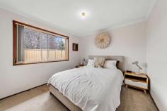  1/26 Bottrill Street Bonython ACT 2905 This desirable home contains all the key elements for young families considering their first home, or for those seeking to downsize. 1/26 Bottrill Street is well-presented and maintained and sits just moments away from local nature reserves and walking trails, Lake Tuggeranong, South.Point shopping precinct, local schools and public transport. A lovely dual occupancy home on a flat, low maintenance block, offering three bedrooms, two with built in wardrobes; a light filled bathroom with shower, bathtub and separate toilet; and a functional kitchen with freestanding electric stove. The open plan living area is light and airy and offers direct access to a small outdoor deck and fully enclosed backyard, large enough for small pets or children to play but without the ongoing maintenance. Be quick to inspect, you won't want to miss your first step to a new, relaxed lifestyle! Features include: Freestanding, single level dual occupancy home Well maintained and presented Separate title, no body corporate fees Ideal for a young family, couple or downsizer Three bedrooms, two with built-in robes Open plan living and meals Practical kitchen with electric upright cooktop Light filled bathroom with bathtub and separate toilet Large laundry with built-in storage and external access Reverse cycle split system plus electric wall heater Blinds on all windows, carpet, and tiled wet areas Small outdoor entertaining deck off dining room Instantaneous gas hot water system, metered separately Private, low maintenance grounds, Colourbond fencing Single attached garage with vehicle access to backyard Plenty of additional off-street parking. 