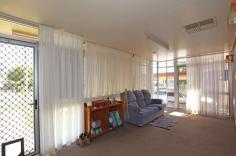  20 Malakoff Street Biloela QLD 4715 $270,000 This comfortable family residence, located within close vicinity to local schools and sporting fields, has loads of potential and presents the perfect opportunity for buyers to enter the market. The property boasts a spacious living room with air-conditioning. A separate, sunken sunroom with floor to ceiling windows, allowing for an abundance of natural light in the home. Bench & cupboard space are both plentiful in the spacious kitchen, which includes a dishwasher, breakfast bar and electric cooking appliances. Three bedrooms with ceiling fans and built-in robes. Two of the bedrooms are air-conditioned. A generous sized family bathroom with a separate toilet. The rear under covered entertainment area overlooks the private back yard and would cater for all your special occasions. The 708sqm* allotment is fully fenced with a double lawn locker, rainwater tank and single car accommodation. If you are searching for a property with plenty of character and potential, this is the home for you. Contact Bronte at Ray White Biloela to arrange your private inspection. 