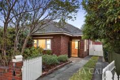  8 Fraser Street Malvern VIC 3144 Set across a substantial single level, this character filled period home showcases classic features which have been meticulously maintained whilst occupying a sizeable allotment in this tree-lined avenue nearby Malvern Gardens. Wide entrance hallway and convenient enclosed porch commence the charming residence which is highlighted through high decorative ceilings, polished floorboards, leadlight features and picture rails. Lounge (fire place) and separate dining room boast desired characteristics and offer formal and informal living zones with highly functional kitchen possessing plenty of cupboard space and room to move. Rear family room opens through bi-fold doors to deck and grassed spaces which are supremely private and cater for entertaining and relaxed living in a salubrious setting. Garage plus driveway for multiple off-street parking spaces and separate storage allow further convenience. Includes ducted heating. Located close to High Street tram, Glenferrie Road shopping, cafes and restaurants, quality schools, parkland and more. Impeccable in condition and enviable in location - this is premium real estate. 