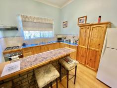  5 Railway St Koorda WA 6475 This beautifully presented 1930’s home is complete with 3-bedrooms 1-bathrooms, 2-bay lockable garage, weatherboard construction and iron roof, carpet & bamboo flooring with tile in the bathroom, laundry and toilet. The home boasts an enclosed carpeted entry room - a large lounge room with carpet, high ceilings throughout, a fire place and reverse cycle air conditioner - dining room with bamboo flooring and raked ceilings which flows into the kitchen allows access to the patio via glass sliding doors. The kitchen comprises of bamboo flooring, gas stove cook top and electric oven. The master bedroom features wardrobes, fan and a reverse cycle air conditioner. Bedroom 2 and 3 both have carpet, with bedroom 3 having access to the patio. The property features a generous sized undercover patio - fully enclosed, and allowing access to the external wet areas (laundry, toilet and bathroom). There's a large lawned backyard and a separate fenced off area at the rear of the property making a perfect place for your chooks to roam. You will also find 2x water tanks (5,000L & 15,000L), solar HWS, lovely established gardens, workshop, storage shed all enclosed around the perimeter with colourbond fencing. The property comes fully furnished including white goods - perfect for the investor! 