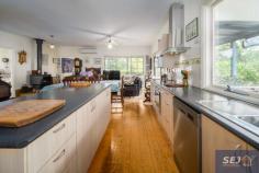  335 Hazel Park Rd Welshpool VIC 3966 $785,000-850,000 Complete privacy surrounded by approx. 4.8 acres of land with a long tree lined driveway leading you home. Charming residence amidst picturesque rambling cottage gardens, orchard, vegetable patch, 4 fenced paddocks and excellent shedding. With wide verandahs on two sides there is always somewhere to sit and catch the sun, listen to the birds, enjoy the peace and quiet. Pretty entrance foyer leads into the spacious open plan interior with easy care polished flooring. The ambience of a wood heater is combined with the convenience of RC/AC to ensure comfort in every season. Every window enjoys views of the stunning garden setting, bringing the outside in to connect you with nature. Modern kitchen with quality appliances, huge walk in pantry and island bench / servery to dining area. Light filled sunroom / studio space or study. Three double sized bedrooms, family bathroom, laundry / utility room and separate w.c. Minimal running costs with solar and mains power and solar hot water. Shedding includes a 3 bay lockable shed with concrete floor, lights and power plus a 3 bay extra height, chook pen, disused dairy and hay shed. Excellent water storage. Quiet rural location just 8 minutes from Agnes Falls with Toora (7 minutes) and Welshpool (8 minutes) a short sealed drive away. 