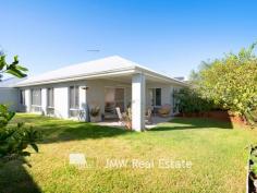  7 Wentworth Loop Dunsborough WA 6281 $795,000 This light filled, stylish family friendly home has been carefully designed and placed on a large 596sqm lot to take advantage of the warmth of the winter sun throughout the living, dining and alfresco rooms and areas. Featuring high 31 course ceilings in these rooms, the spacious well-appointed kitchen features 900mm appliances, stone benchtops, a dishwasher and a massive island bench which has many cupboards and drawers and also doubles as a breakfast bar. The main bedroom is more than generous in size, has a walk-in robe and a large en-suite with a stone top vanity, shower and separate WC. The three minor bedrooms are all oversized, include built-in robes and provide ample room for any size bed with space for other furnishings such as a chest of drawers, desk etc. An activity-come-study area is located between these bedrooms which are serviced by a bathroom with shower, a large bath and vanity and a separate WC. All 4 bedrooms have ceiling fans. At the front of the home is a private home theatre / second living area. The double garage has direct access into the 2 metre wide hallway and gives you plenty of room for cars or extra storage space. This is a sought after location and the property is amongst homes of quality and within an easy walk to the white sands and turquoise waters of Quindalup Beach and Geographe Bay. 