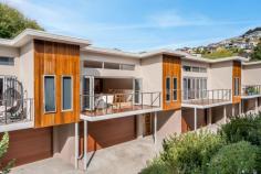  9/337 Churchill Avenue Sandy Bay TAS 7005 $895,000 At the forefront of contemporary design, this light-filled town residence by award-winning Anard Construction showcases superior quality, unforgettable style and breathtaking proportions with easy access to all Sandy Bay has to offer. Defined by a blend of raw materials and a soft coastal palette, the stunning proportions are amplified by the high ceilings, natural timber floors and oversized glazing, inviting in the leafy and private aspects to promote effortless indoor-outdoor living. Glass bi-fold doors and highlight windows help illuminate the open-plan living area in the afternoon sunshine, connecting a large decked terrace with a stunning stone-bench kitchen equipped for lavish entertaining with a suite of quality stainless steel appliances. The first-floor master is positioned for optimum peace and is fitted with a deluxe ensuite and walk-in robes. Two robed bedrooms are located beside a sleek family bathroom and Euro laundry in a separate accommodation wing downstairs, adding to the low-maintenance ease. Located within the foothills of Mount Nelson and only 5-minutes from the shoreline and the spoils of Sandy Bay, this is a quintessential lock-and-leave weekender or carefree permanent home, appointed with double glazing, waterfall stone benchtops, reverse cycle heating and cooling, and a double remote garage with internal access. 