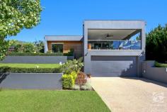  4 Cottlesloe Court West Wodonga VIC 3690 $999,950 Constructed by award-winning Trentwood Homes, this family home offers a standout street presence with contemporary features seldom found. Enjoying an elevated position overlooking the Wodonga Golf Course, this entertainer's delight will be the envy of family and friends. The sophisticated style seen throughout the home is evident as soon as you enter. Stunning polished concrete floors and expansive windows allow the open plan living and dining area to fill with natural light. The generous formal lounge provides space for the growing family, while the open plan living/dining and kitchen area is the hub of the home. The gourmet kitchen is sleek and modern, highlighted by stone benchtops, high-quality appliances, and an abundance of storage options, sure to impress even the fussiest of home cooks. Comprising of four generous bedrooms, all including built-in storage. The master is complete with his and hers walk-in robes and a beautifully appointed ensuite. The remaining bedrooms are serviced by the stylish family bathroom, with floor-to-ceiling tiles and a stunning freestanding bath, the perfect spot to wind down after a long day. Enjoying a multitude of entertaining zones, the rear yard offers an alfresco with peaceful surroundings, natural materials, and beautifully landscaped gardens, ensuring there will be no better space to enjoy your morning coffee. Perched on the first floor offering fantastic views of the neighbouring golf course, the front alfresco is ideal for night entertaining. This space flows beautifully to the fire pit area, making this the perfect party zone. Other notable features include; an oversize double garage, a fully irrigated yard, double glazed windows throughout, evaporative cooling, and ducted gas heating. With an enviable location and outstanding quality, this home is truly an eye-catcher, call today to arrange your inspection! 