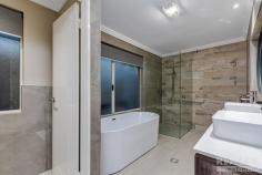  22 Ammanford Cres Butler WA 6036 $600,000 This immaculate family home has the WOW factor and needs to be seen to be appreciated! You will be blown away with superb quality of fixtures and fittings throughout the property. Welcome to this Ultra-Modern – totally renovated family home, which is safe and secure in a quiet location with a lovely park 100m down the street. You are close to schools, shops, parks, the Butler Train station and all amenities. Features of the home: • Huge master suite is secluded at the front of the home with a study/nursery and WIR. Private luxurious en-suite completed with frameless shower, 1800mm free standing bath, double floating vanities, and separate W/C • Separate bedroom wing encompasses 3 large bedrooms with WIR’s sharing the family bathroom completed with frameless shower, 1800mm built-in bath and floating vanity • Mom will fall in love with the Chef’s kitchen with LED strip lighting, plenty of cupboards & bench space, stone bench-tops with waterfall edge, 900mm stainless steel appliances, double fridge recess and corner pantry • Sit back, relax and watch your favourite movie in the theatre room with mood lighting • The large open plan living, and dining areas flows to the games room and alfresco area • Games room is fitted with a bar with essa stone benchtop and bar fridge nook • Enjoy BBQs with family and friends under the timber lined alfresco with TV & aerial point, gas bayonet and feature fireplace • Splash away in your heated 8m saltwater pool with stone waterfall Some of the extras Include: • Double remote garage (29C) with built in storage & overhead cupboards • 6.6kW solar system • 14kW Zoned ducted reverse cycle aircon • Access and additional parking for trailer / camper van / boat • Full CCTV system with audio recording & security sensor lights to the front of the property • Quality stone features, top quality carpets, porcelain tiles, roller blinds • Brand new hybrid waterproof marri flooring & skirting boards • Wide entry with 30C ceiling and 33C ceilings to living & games areas • Coffered ceilings in master bedroom and theatre room • Laundry with extra storage • Synthetic lawn in the front and back gardens • Security screens to front entry and minor bedrooms AND THE LIST GOES ON …. Built in 2005 by Ross North Homes on a 608m² block 