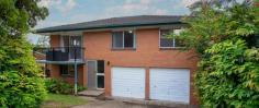  388 Mount Gravatt Capalaba Rd Wishart QLD 4122 With 3 bedrooms and living areas upstairs, and heaps of room downstairs for storage or utility rooms, this house is ideally placed to become a home.  Huge 698spm block with lots of potential.   Situated minutes from Westfield Garden City and Carindale, all of your shopping needs will be satisfied. Features include: *  3 large bedrooms with built in wardrobes *  Large kitchen with electric appliances and adjoining dining area. *  Lounge with patio at the front *  Downstairs are 3 good sized utility rooms for home office or storage *  2 car lockup garage *  Large backyard with room for extension.   Location Features: *  Minutes to Westfield Garden City and Carindale shopping centres *  Easy access to Gateway Motorway and SouthEast Freeway for your daily commute *  City buses at front door *  Catchment for Wishart Primary and Mansfireld State High Schools *  Griffith Nathan and Mt Gravatt just a few minutes away 