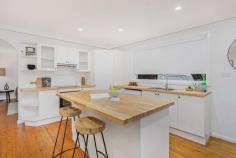  15 Queen Street Berry NSW 2535 $1,380,000 - $1,450,000 Boasting a classic single level home with a fresh refurbishment, featuring an open plan kitchen, living and dining room with timber floorboards, air conditioning, a separate living room embellished with shutters and new carpet to the bedrooms. This home is full of natural light and flows to the generous outdoor alfresco, perfect for meals and entertaining. You will love the gorgeous back garden bathed in sunlight and the bonus external living room which is generously sized, carpeted and has French doors opening up to a timber deck. This could be your new work from home space and/or entertaining area. The fenced back garden has a beautiful northern aspect and is ready for children, family games and pets. The home offers plenty of off street parking and is gated. Walk into the Berry village just a short 3 minutes away and enjoy the village life style offering boutiques, home-ware and gift shops, gourmet cafes, fine dining restaurants and the Berry train station. Berry is situated just a short drive from Shellharbour/Kiama/Gerringong, take the scenic route from Berry to historic Kangaroo Valley or an easy 15 minute drive to the Nowra Business District and shopping centre. 