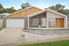  33 Harkin Avenue Wodonga VIC 3690 $750,000 With blocks of land in the region becoming a rare commodity and build times dragging out, why consider building when all the hard work has been done, and you can move in now! Superbly built by master builder Havn Homes, this beautiful executive style home abounds in quality and design. With multiple materials making up the facade, including timber panels and two brick tones, this home has striking street appeal. Central to the home, the open plan living and kitchen area feature high ceilings and a skylight, basking the abundant space with natural light. This large open area is floorboarded and features a large, fashionable timber barndoor. Stone benchtops with a waterfall finish separate these spaces. The kitchen offers a walk-in pantry, 2-pak cabinetry, and stainless steel appliances, including a dishwasher, gas stovetop, and an electric wall oven. The home provides space for all by design. Zoned in two halves, with the master bedroom and formal lounge to the front of the home and the remaining bedrooms to the rear, with a third living room. The perfect place for a study or kid's play area. The master bedroom is complete with an abundant ensuite and walk-in robe. Bedroom four features a walk-in robe with access to the rear yard, while the other two bedrooms offer built-in robes. The family bathroom and ensuite, are set up as wet rooms with floor-to-ceiling tiles. The master with double vanity and a luxurious oversized shower. The outdoor area includes an under-roof alfresco directly off the family room, extending your already large entertaining space. The low-maintenance secure rear yard provides for any member of the family a safe and secure place to explore. The oversized double lock-up garage provides internal, secure access to the home. 