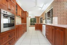  54 Dwyer Circuit Driver NT 0830 This large four-bedroom home offers enormous potential for you to add significant value with a few easy modern touches. Three separate living areas are set around the quality central kitchen, and there's plenty of low-maintenance alfresco entertaining space on the covered rear verandah and paved terrace. You'll also love this prime setting opposite Palmerston Golf Course and parklands, and walking distance to all major amenities in neighbouring Palmerston CBD. Large formal lounge/living area with bright bay window Separate dining and family rooms open to rear verandah Central kitchen with quality timber cabinetry and dishwasher Master bedroom with built-in robe, walk-in robe and ensuite Three additional beds; built-in robes to second and third beds Main bathroom with shower over bath and separate toilet Internal laundry with built-in storage and outdoor access Modern floors tiles to living areas; carpet to bedrooms Low-maintenance paved backyard with garden shed Covered parking for two cars in tandem carport at side Exposed brick feature walls throughout will be the centrepiece of your modern interior design, and there's plenty of space for your growing family to thrive with generous proportions throughout. Enter into the reception foyer where you'll find the large master bedroom privately located at the front of the home on your right. It overlooks the tropical front gardens through an elegant bay window, and features an ensuite, walk-in robe and an additional built-in robe. There is also a bay window to the large formal lounge/living area that is also located at the front of the home and flows through to the separate dining room. Double doors open onto the corner rear verandah, and the dining area connects to the central kitchen that features quality timber cabinetry. The family room also opens onto the rear verandah, and the second, third and fourth bedrooms join the main bathroom and separate laundry off the family room. You can get rid of your lawn mower thanks to the paved backyard, and a garden shed provides extra storage space. Act fast to secure this large, high-potential family home. 