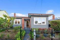  4 Rattle Street NEW TOWN TAS 7008 $975,000 Beautifully renovated throughout, this family home radiates a mixture of modern plus period features. Right from the moment you enter, the vibe is warm and comfortable, complemented with the ducted Daikin reverse cycle air conditioning system, double glazed windows throughout and carpeted bedrooms plus living room. The remainder of the home features hard floors, with large modern tiles in the kitchen and dining area plus tiled bathroom which has recently been updated. The kitchen has modern appliances and two island benches which provide separation from the dining area plus a perfect servery for entertaining. All three bedrooms are spacious, and have built-in wardrobes, the second also has a Murphy bed and toilet with vanity. Sliding barn doors allow separation from the hallway to the kitchen and dining and the walk-in laundry provides plenty of space for extra kitchen appliances and storage. Outside continues to impress, with the plentiful array of raised garden beds with vegetables and fruit trees surrounding, plus two garden sheds for garden equipment to be stored in. A lined studio is perfect for the home office, or retreat with a reverse cycle air conditioner and there is a single garage plus additional off street parking. A tightly held location, in close proximity to shops, schools, cafes and more, this charming home will definitely impress and is well worth an inspection! 