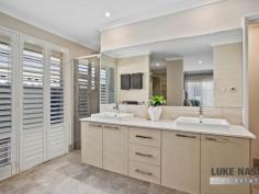  18 Ornata St Byford WA 6122 $500,000 Welcome to 18 Ornata Street Byford. This absolutely stunning super size 4×2 home is located in the highly sought after ‘Glades Estate’ situated on a family friendly low maintenance 510sqm block. With a total build area of 289m2 this gorgeous home will cater for the largest of families looking for expansive open spaces and double size bedrooms. With 3 big living areas and a stunning feature kitchen with scullery, this beauty with tick all your ‘I WANTS’ Boasting features galore this quality modern home is definitely a power house of the ‘Glades Estate’ With Woodland Grove Primary School, public open spaces just a stroll away and the Strand Lakeside Cafe and shops close, everything you need is on your doorstep, making this a highly sought after family home or investment. Selling features of this stunning home include: Fabulous street facade with portico entrance – Easy care front gardens with easy on the eye artificial lawns – Double remote garage with extra wide driveway – Feature front door with wide welcoming entrance – Shoppers entrance off the hallway – Hollywood style master suite with his and hers walk in robes – Open style feature ensuite with twin sinks separate WC and an intimate double shower – Huge theatre room with feature barn door entry – Jaw drooping open plan kitchen, meals, family and games area which is the hub of the home – Beautiful chefs kitchen with a mixture of soft closing cupboards and pot drawers, Westinghouse appliances, 5 burner gas hob, electric oven, dishwasher, double fridge recess and walk in scullery WOW – Large open plan meals, family and games area – 3 double size guest bedrooms all with built in robes – Super size guest bathroom with bath and shower – Good size laundry – Separate WC – Walk in linen – Timber decked grand alfresco and shade sail area – 2 artificial grass areas, one for the pets one for the kids – Garden shed and rear access to the backyard from the garage. Other features include: Ornate floor tiles throughout the thoroughfares and living areas – Roller shutter to the front master suite – Ducted reverse cycle air-conditioning – Attractive window treatments plus feature internal Plantation Shutters – Gas hot water system plus much more. 