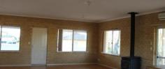  75 James St Goomalling WA 6460 $339,000 - Light and bright Spadaccini built 244sqm brick and colourbond 3 bed, 1.5 bathroom house - Block size 2002sqm - Top end of town overlooking farmland -  Double frontage, level corner block - room for a studio, granny flat, workshop, shed, chooks, vegetable garden or a swimming pool - Three double size bedrooms: built in wardrobe in main bedroom and walk in robes in 2 bedrooms - Spacious bathroom with bath and walk in shower, large powder room separate - Huge open lounge, family, dining, computer nook, generous kitchen with walk in pantry – provision for dishwasher in kitchen cabinetry with plumbing and electrical connections installed - Entry hall/"mudroom" with all purpose built in cupboards. Giant linen cupboard in hall - Large laundry with more inbuilt storage cupboards - Higher than average ceiling height of 2.7m - Electric roller door 2 car garage, with access door into the home. Lots of space on block for several vehicles - Wrap around verandahs on 2 sides - Big 68sqm north facing patio, undercover drying area - Split system airconditioning - New solar hot water system - Near new Masport wood heater - Water saving garden - Fully enclosed yard with new quality colourbond fencing - Close to town infrastructure and amenities - Built in 2000, a much loved and cared for house!!! 