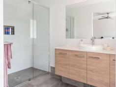  24 Earls Court Goonellabah NSW 2480 $995,000 - $1,045,000 With a commanding street presence, the scale of this home is evident from the moment you arrive. Designed with the large family in mind, the functional layout, quality of construction and the level of finishes will leave you wanting for nothing. Boasting four large bedrooms - the main with his and hers walk in robes, generous ensuite and a stunning outlook, the other bedrooms have built in robes and the home has extra high ceilings throughout giving a real feeling of space. The heart of the home is the open plan, air conditioned, kitchen, dining and lounge area, seamlessly flowing from the kitchen, right through to the front balcony - large enough for a dinner party and taking full advantage of the leafy outlook. The kitchen is stunning with stone tops, island bench and a beautiful pendant light while the chef will love the 900mm freestanding oven and gas cooktop. Storage is a breeze with a large butlers pantry along with appliance bench. The rumpus room to the rear of the home opens directly out onto the covered entertaining area with steps leading to the large flat rear yard, the ideal place for a game of soccer or cricket, space for a trampoline or even a pool. Fully fenced and ideal for pets, there is simply nothing to do. Avoid the delays and uncertainty of building costs - your opportunity to skip the que is right here.. 