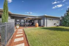  2 Cramer Street Kilgariff NT 873 $829,000 Behind the security of a tall fence and electric remote-controlled gate, this home is impressive, generously proportioned, and contemporary. The home incorporates a welcoming open plan kitchen/dining and family area with three spacious bedrooms, two of which include large walk-in robes and one a with study nook. The master bedroom is luxurious and offers an ensuite complete with twin vanity, an open shower, and floor-to-ceiling tiling. The functionality of the second bathroom is well designed with a free-standing bathtub, open shower, wall hung vanity, and toilet. The additional bedrooms located on either side of the bathroom are of great size with plenty of space to move around. The sleek and stylish kitchen consists of a freestanding cooktop and oven, a modern canopy range-hood, ample storage and preparation space, and a stainless-steel dishwasher. Designed for the modern family, the island bench divides the space and overlooks the outdoor entertaining area. The stunning mix of colour and lush green lawn is captured through the extensive use of glass. The full-length sliding doors provide easy access to the outdoors and the views of the famous Macdonnell Ranges in the distance are just magical. The convenience of split system, air-conditioning, and ceiling fans throughout this home ensures absolute comfort all year round. The 6 kW solar panels are a convenient addition to the home with the bonus of a water softening system. Features include: – 3 Bedrooms, 2 Bathrooms – Split System Air-Conditioning throughout – Eco-friendly Bio Ethanol Fuel Fireplace – Water Softener – Gas Cooking – Outdoor undercover entertaining area – Built-in Bar – Garden Sheds – Double Carport – Solar Electricity – Secure fencing with an electronic gate – Multiple dwelling option – and so much more……… This property is the complete package and will not be on the market long. 